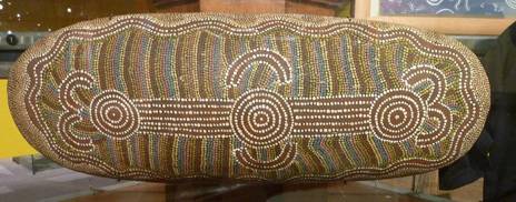 Australian aboriginal softwood coolamon with acrylic paint design. 